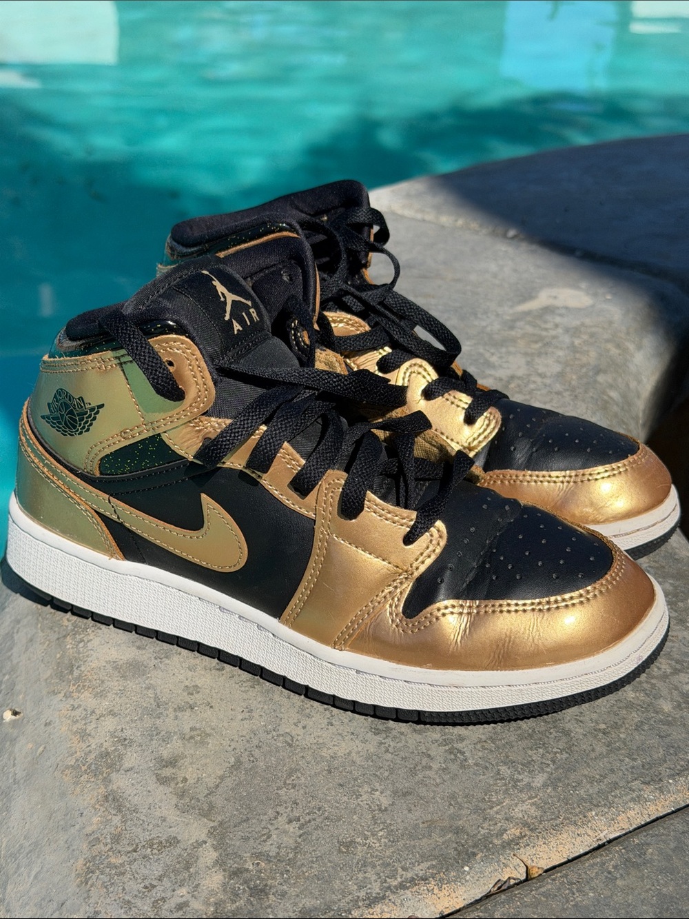 Nike Air Jordan 1 Mid Black & Metallic Gold Sneakers